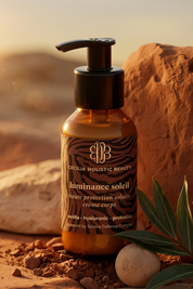 Bottle of Cecilia Holistic Beauty luminance soleil cream with desert landscape in the background