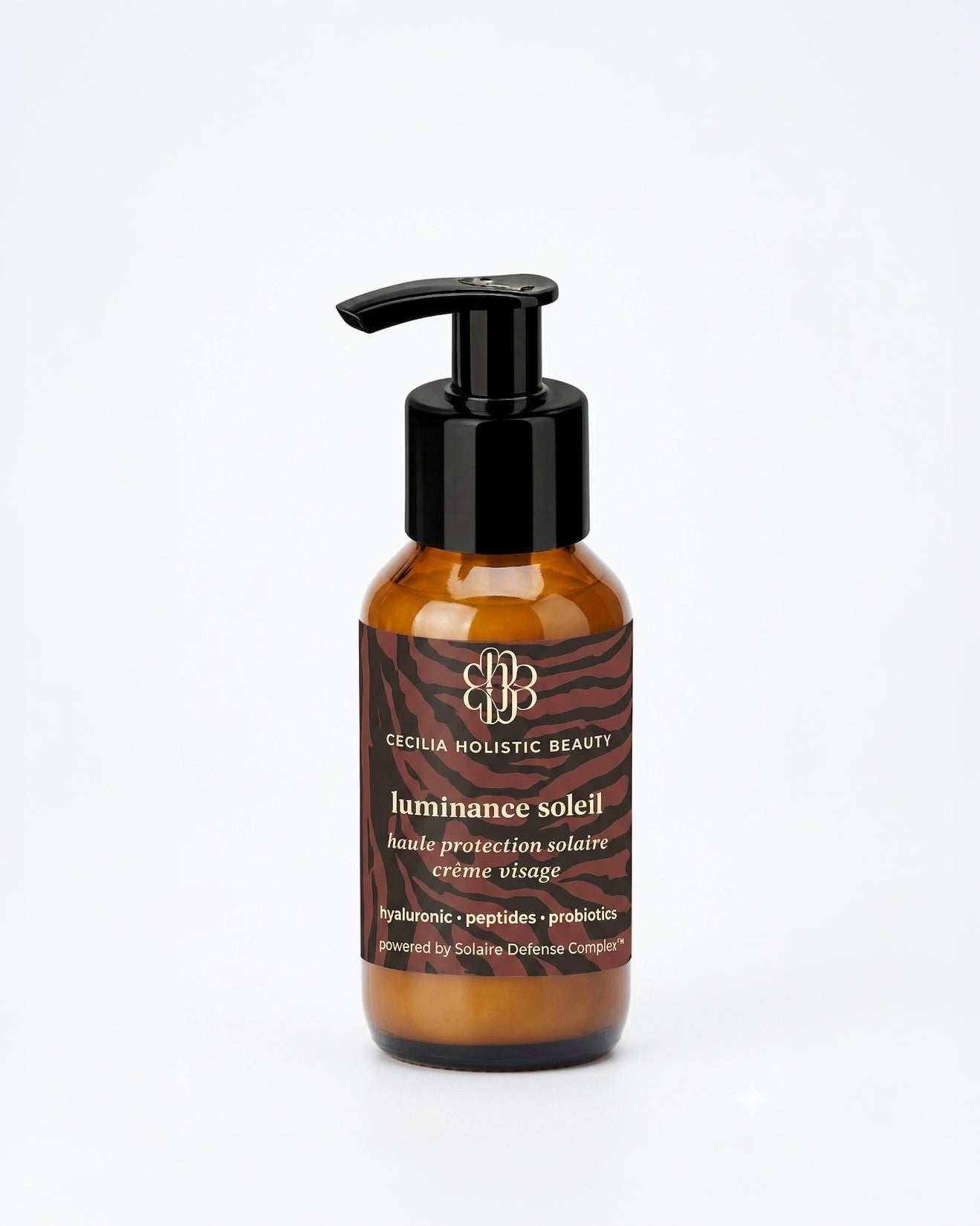 Brown bottle with black pump and label on a white background